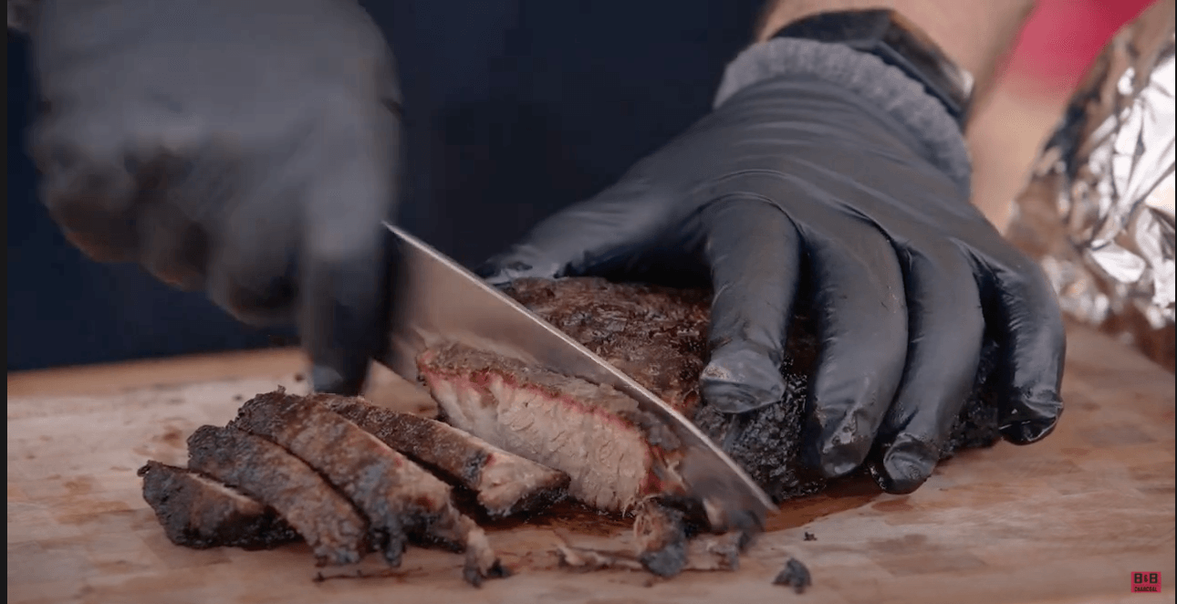 grilled chuck roast sliced on a cutting board