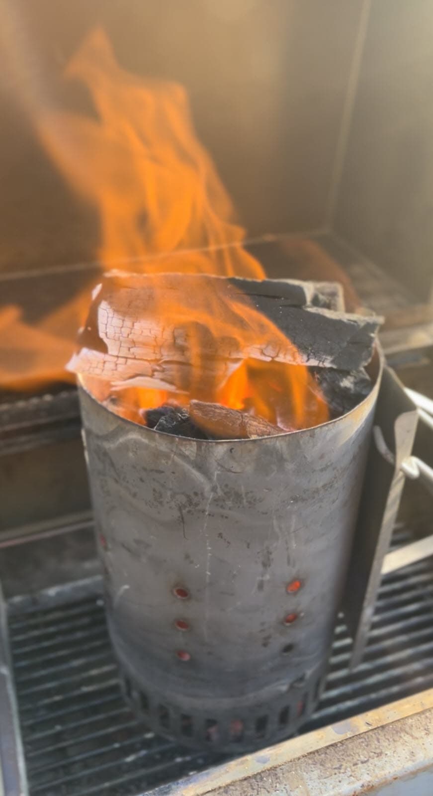 Charcoal Chimney with lump charcoal on fire