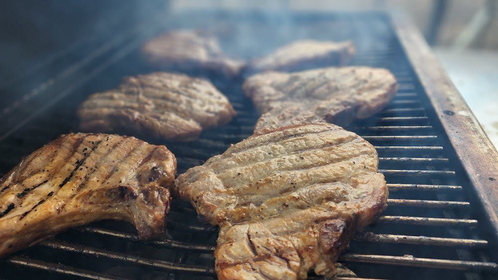 Sliced Chicken cooking over the grill