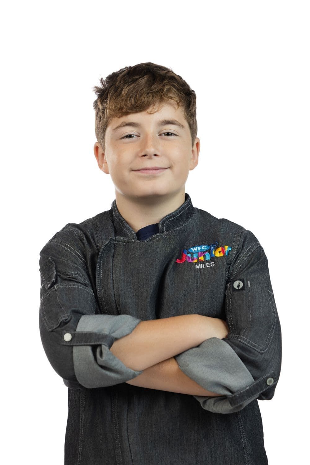 Team B&B Future All Star Miles O’Guin with crossed arms wearing a dark shirt against a white background