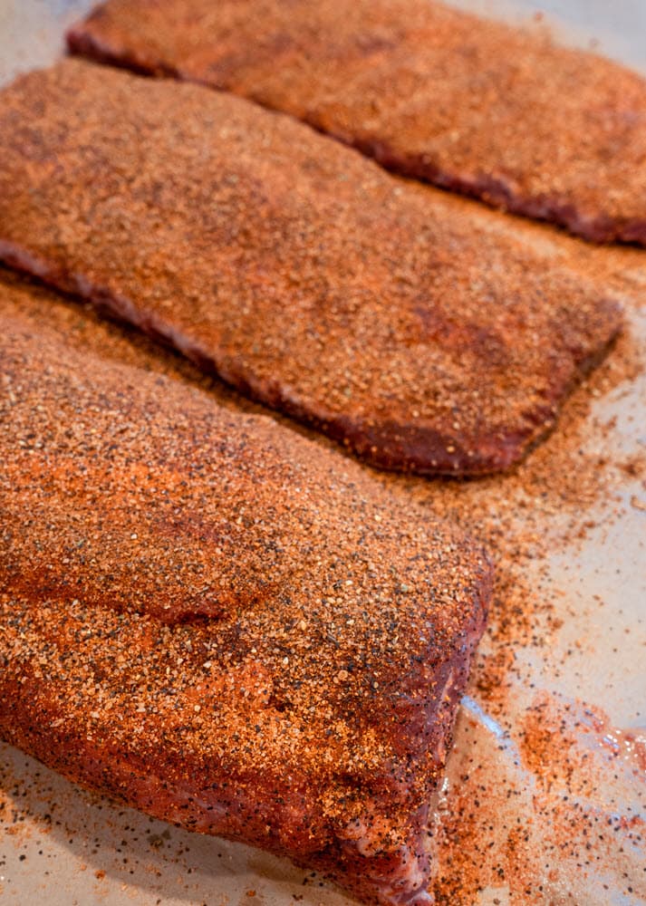 raw pork spare ribs seasoned  with rub