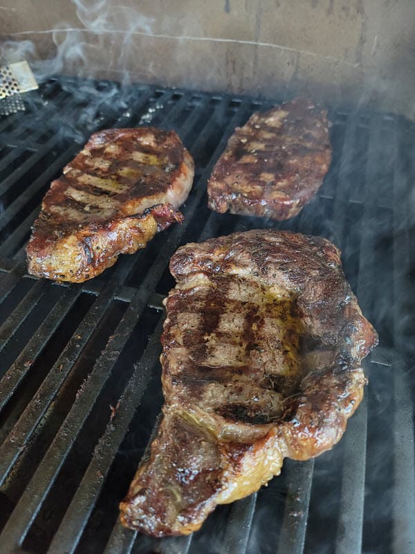 Ribeye steaks on the grill