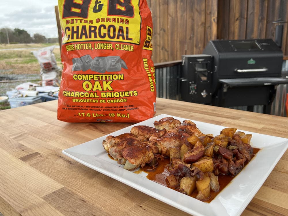 dutch oven BBQ chicken, potatoes and B&B charcoal briquets bag