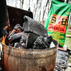 B&B Hickory Lump Charcoal lit in charcoal chimney, lump charcoal manufacturer, charcoal manufacturers in usa