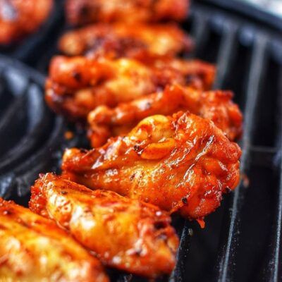 Grilled chicken wings cooking on grill
