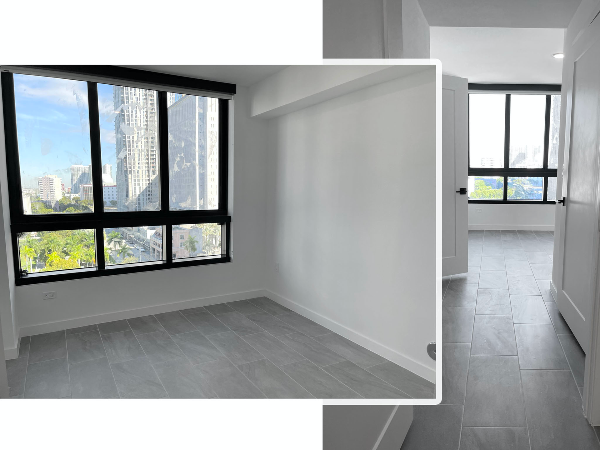 Interior of a modern apartment with large windows, city view, and gray tile flooring.