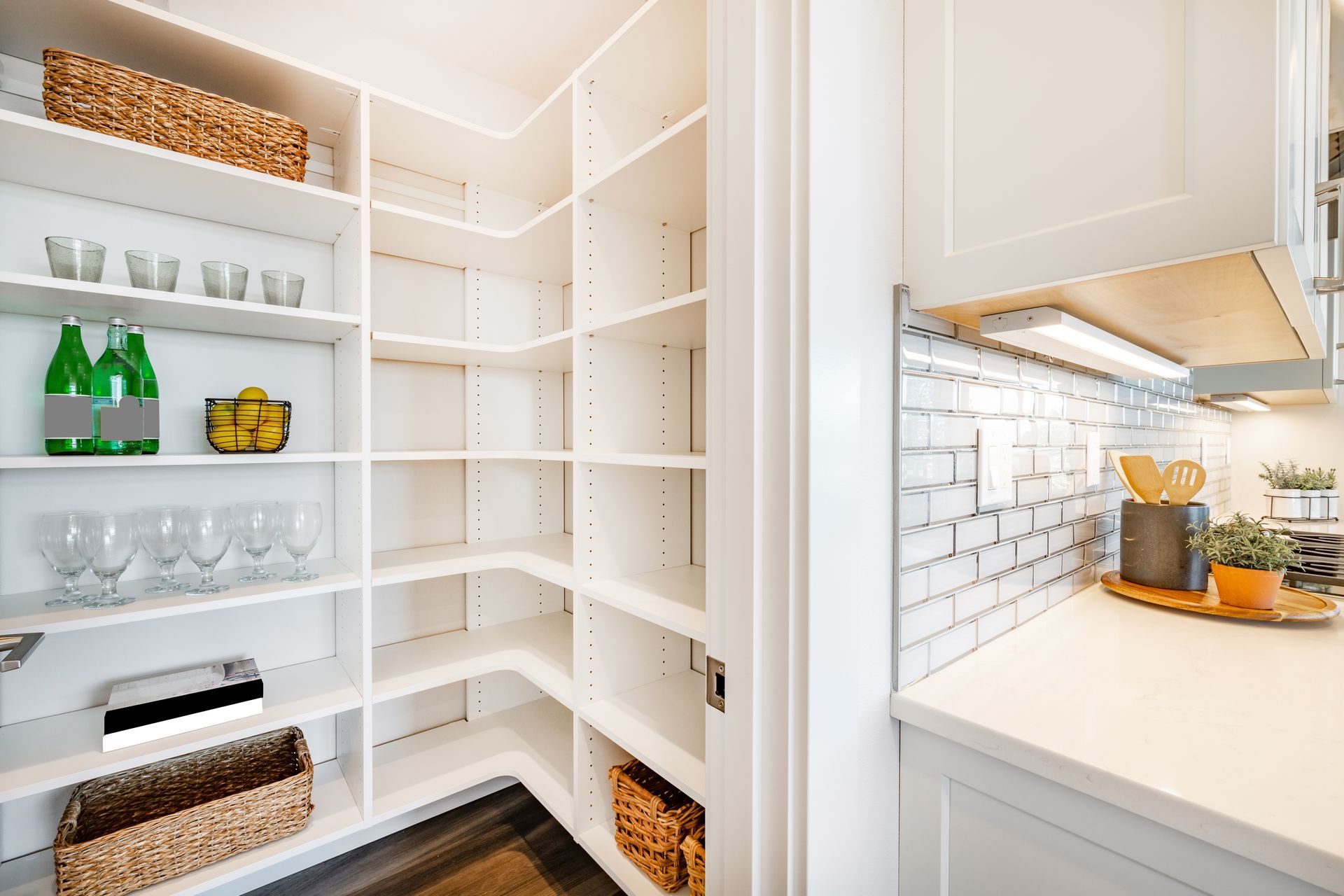 A kitchen with a lot of cabinets and appliances