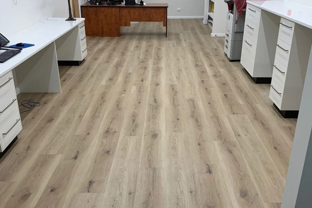 Office Interior With Wood-look Flooring and White Desks Along Walls — Ozwide Flooring In Ciccone, NT