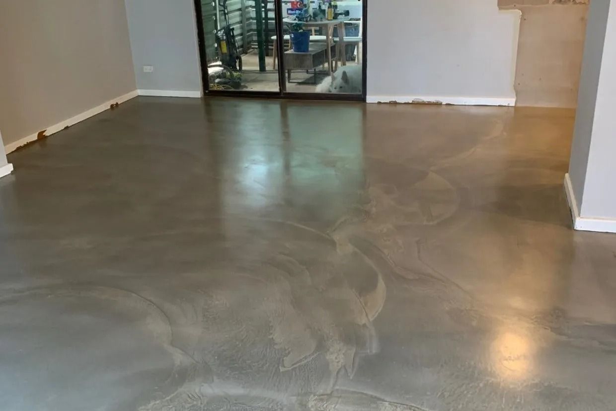 Polished Grey Epoxy Floor Reflects Light in a Room — Ozwide Flooring In Ciccone, NT