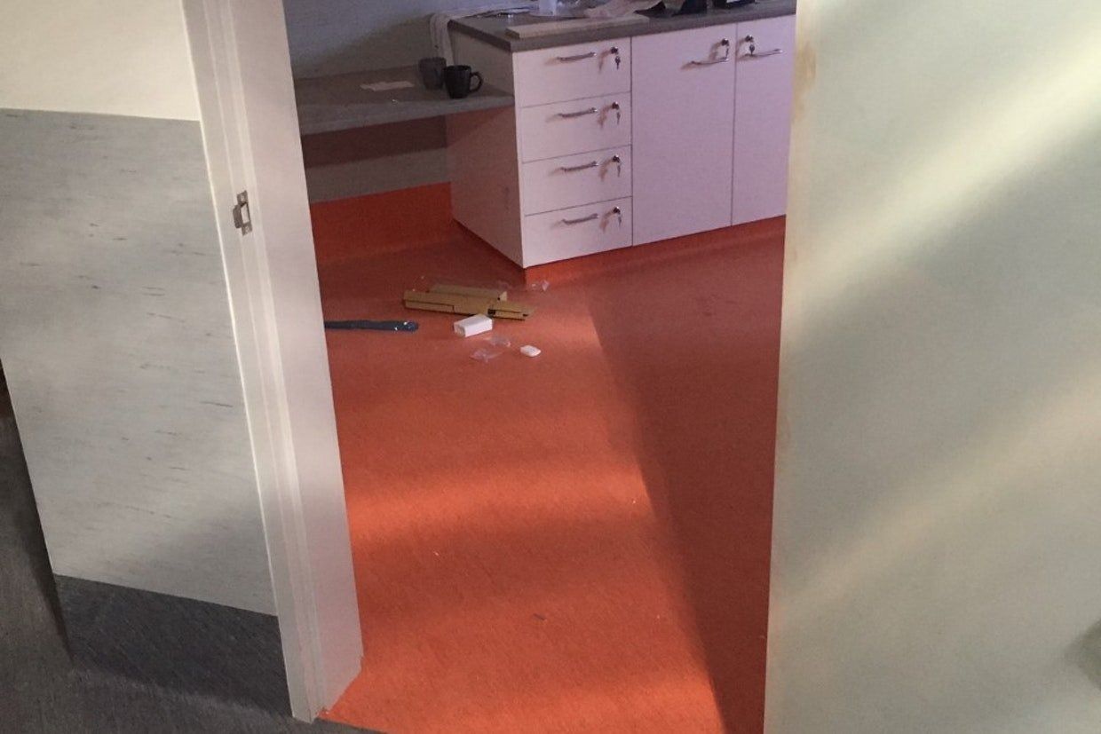 Orange Floor, White Cabinets, and Doorway in a Room — Ozwide Flooring In Ciccone, NT