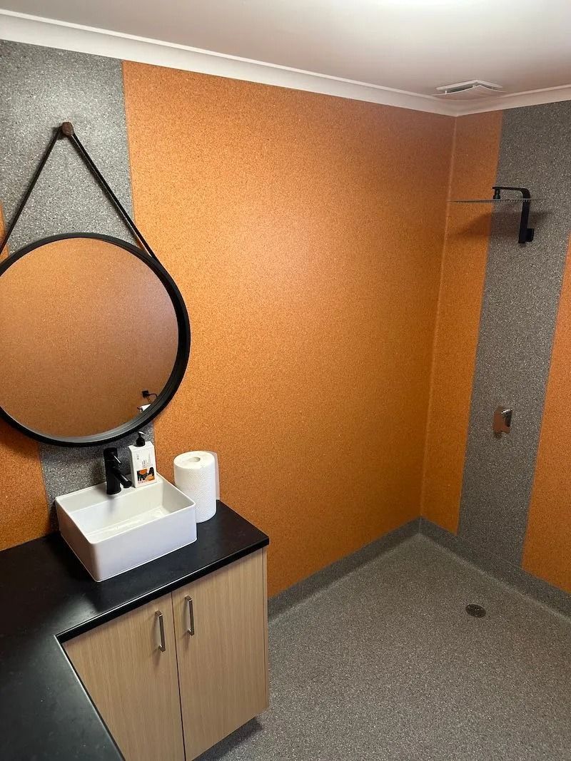 Bathroom With Orange and Grey Textured Walls — Ozwide Flooring In Ciccone, NT