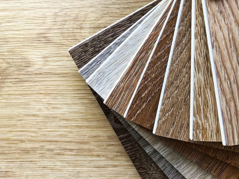 Wooden Flooring Samples Fanned Out on a Wood Surface — Ozwide Flooring In Ciccone, NT