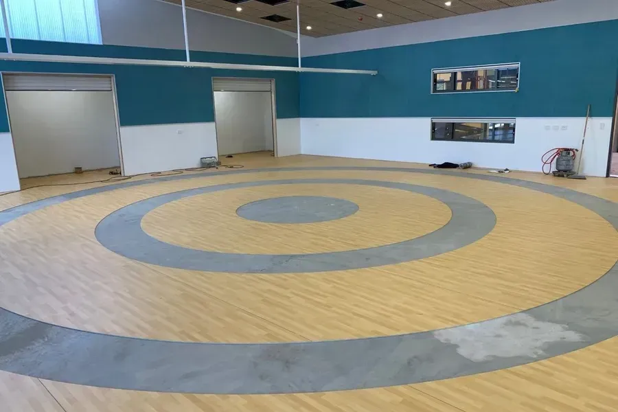 Gymnasium With Circular Wrestling Mat Design — Ozwide Flooring In Ciccone, NT