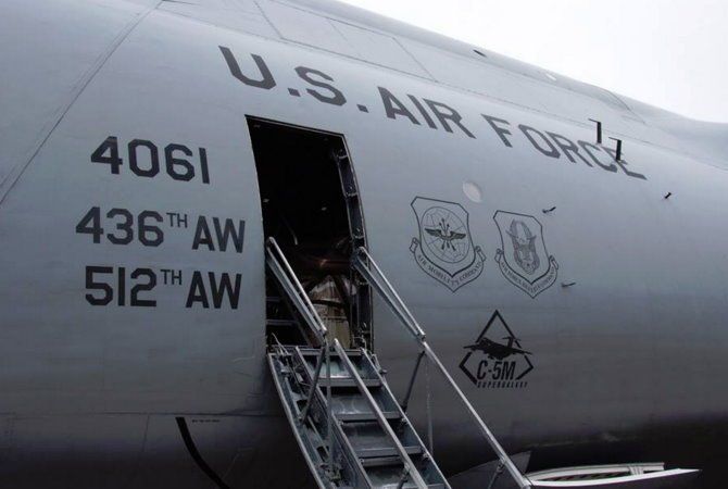 U.S. Air Force aircraft fuselage with open door and stairway, marked 4061, 436th AW, 512 AW