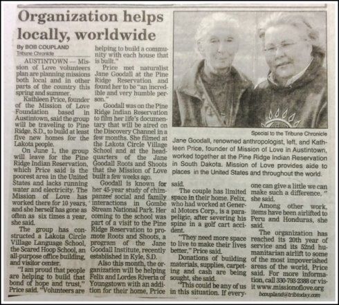 Newspaper clipping about local organization, with headline and a photo of two people standing together