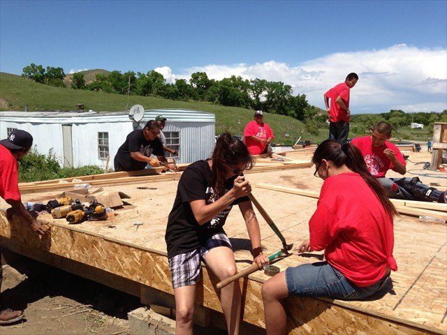 A group of people working at Pine Ridge Reservation
