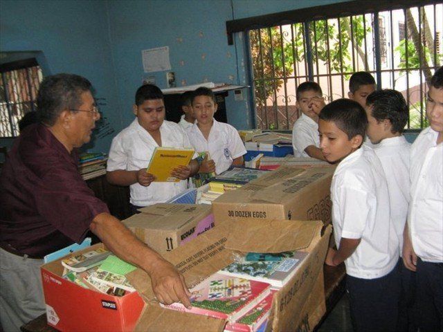 Students happy with their donation of books from the Mission of Love via the Denton Airlift.