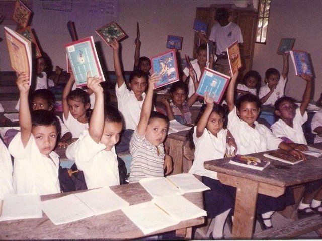 Honduran children happy with their books from the Mission of LOVE.