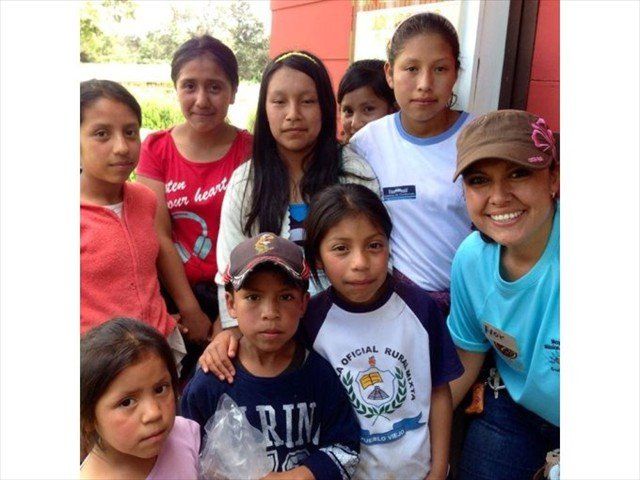 FLOR WITH SOME OF THE MAYAN CHILDREN WHO ATTENDED THE FIESTA.
