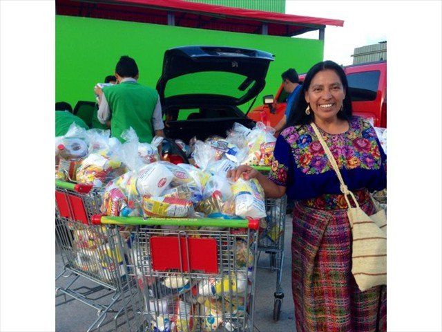 PAULA HELPING EDWIN AND I PLACED 125 FOOD BAGS INTO TWO VERY SMALL VEHICLES FOR THOSE IN NEED @ WAY-BI. FUN DAY TO SEE IF WE COULD MAKE THIS A REALITY. WE DID AND SO MANY MAYAN FAMILIES BENEFITTED FROM OUR GIFT OF BEANS, RICE, OIL, SUGAR, SALT, FLOUR, COFFEE, & COOKIES.