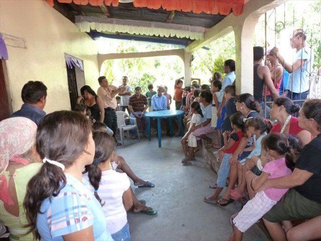 Julio speaking to the the Honduran families to let them know that someone cares about their fate.