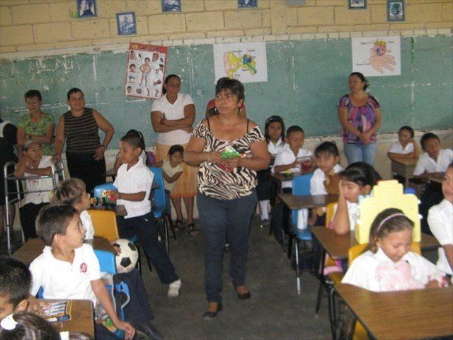 Honduran classroom receiving donations of toys for the students.