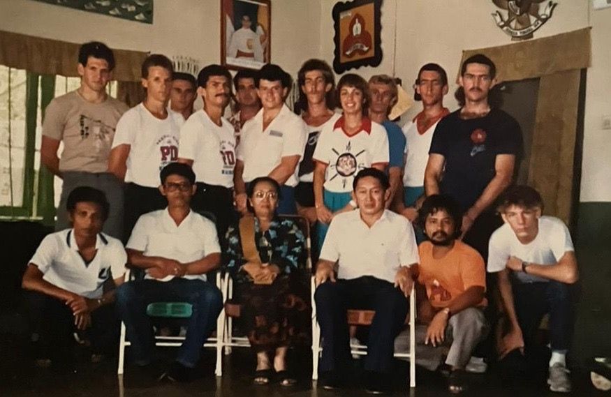 A group of people posing for a picture in a room