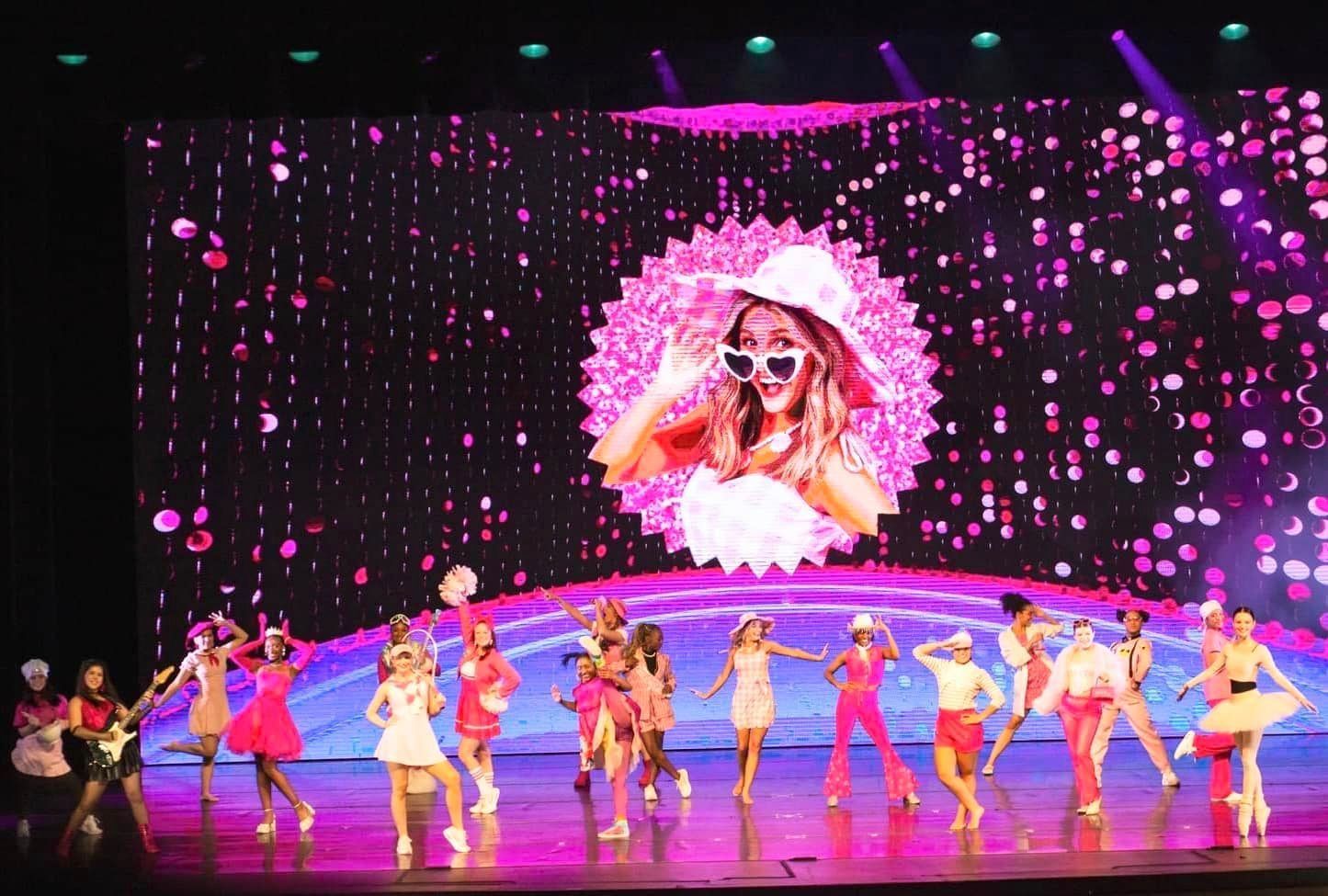 2024 dance showcase with dancers on stage and screen