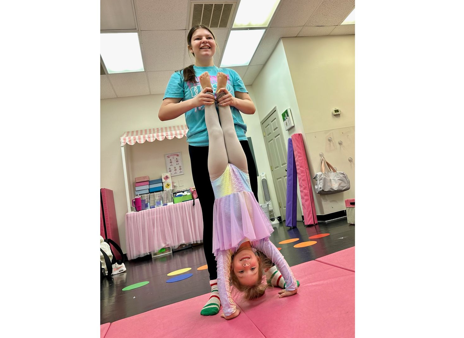 Dancers from the pre-school and kindergarten classes doing a handstand