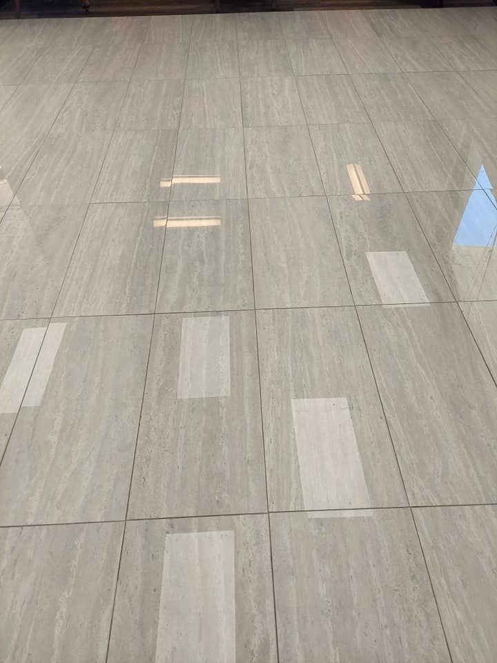 A close up of a tiled floor in a room.