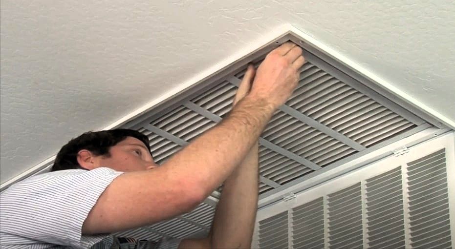 technician replacing air filter