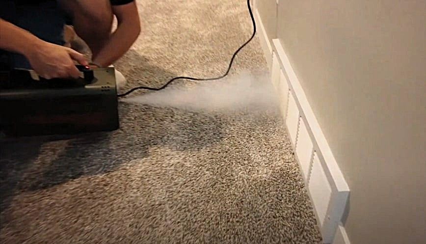 A technician uses a specialized machine to sanitize air ducts