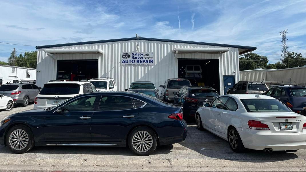 Auto Repair Shop Exterior With Customer Vehicles in Safety Harbor, FL | Safety Harbor Auto Repair