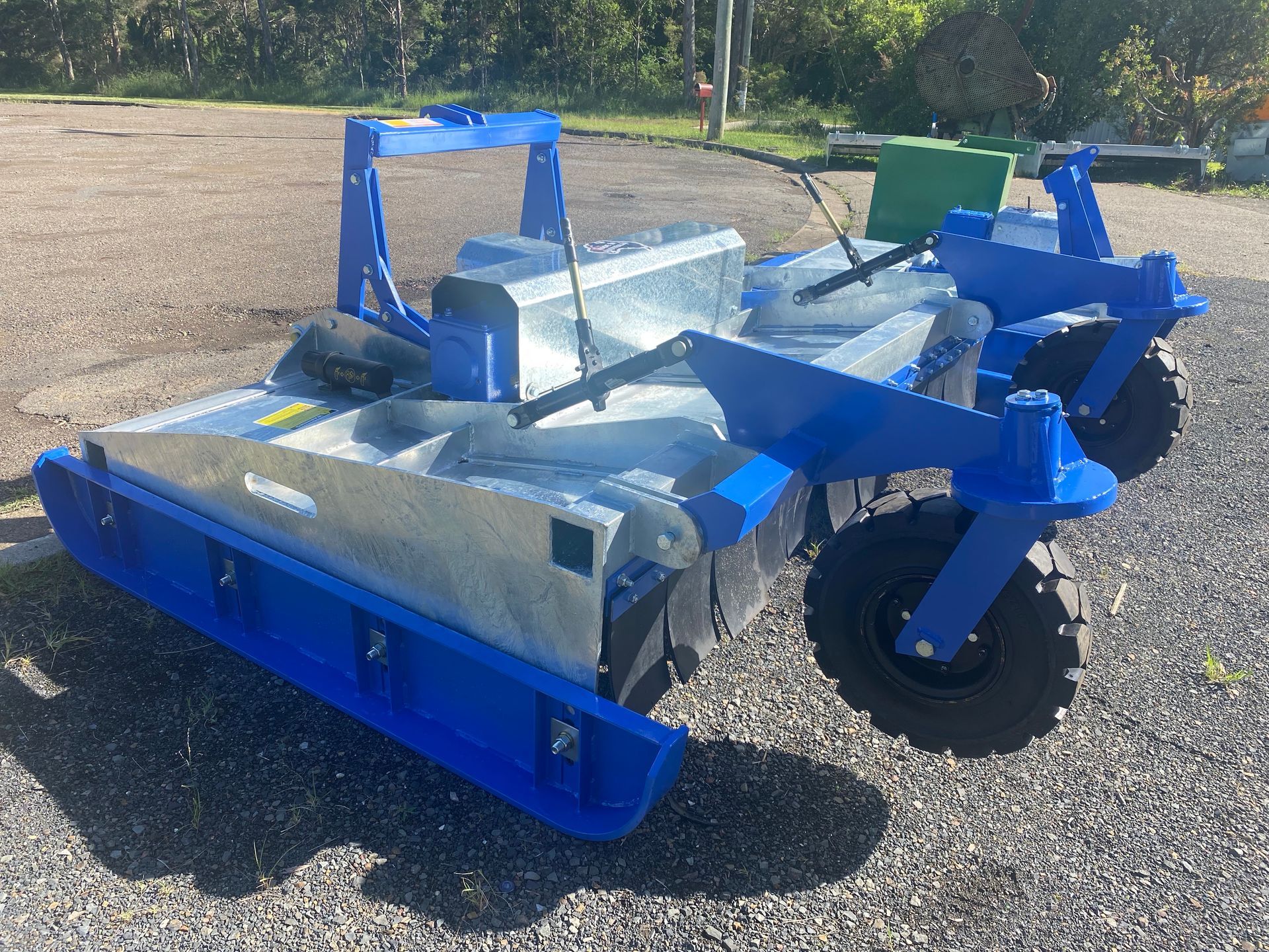 A Black Machine is Sitting on a Wooden Pallet — Wingham Farm Machinery in Wingham, NSW