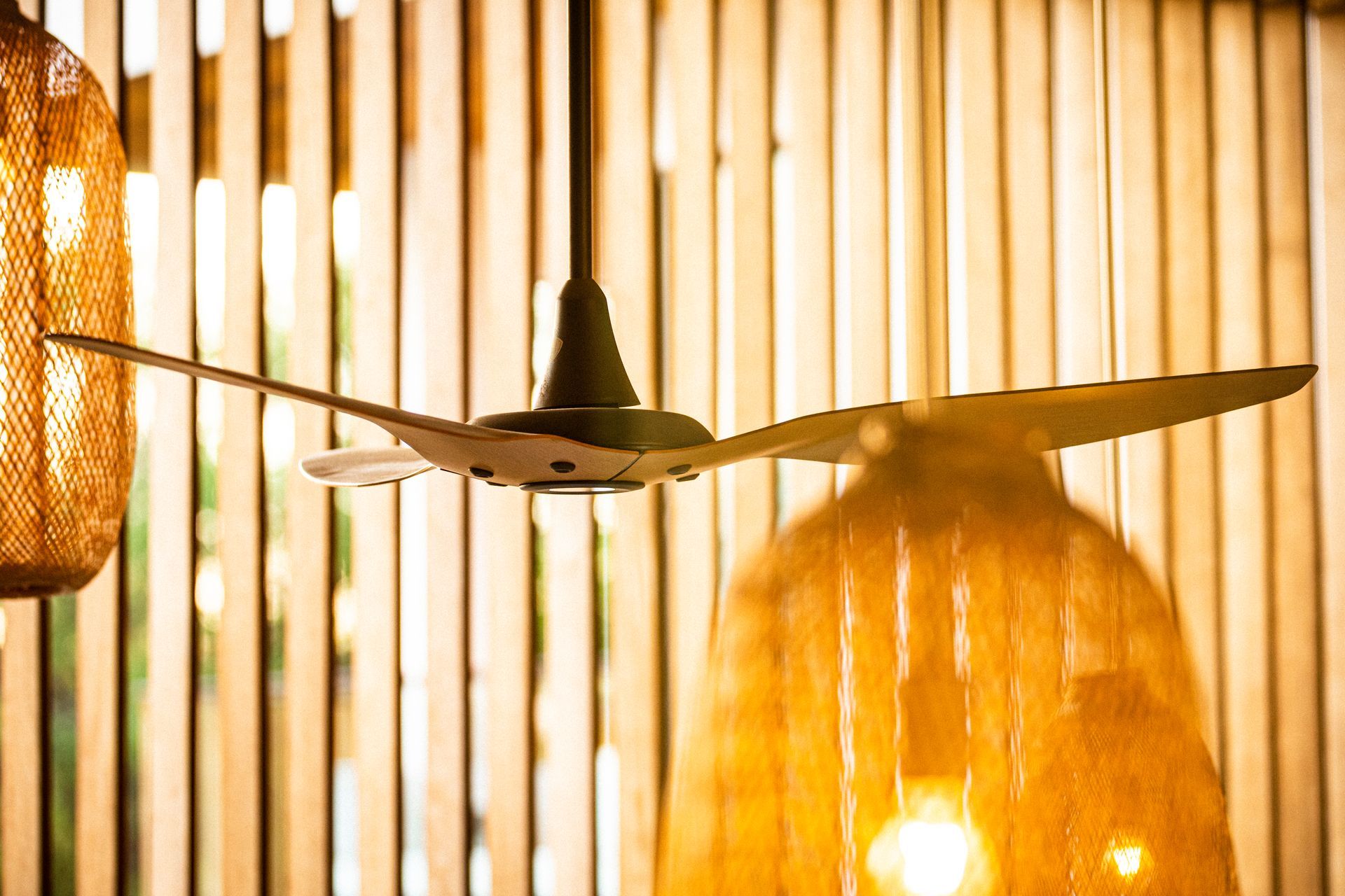 A ceiling fan in a master bedroom
