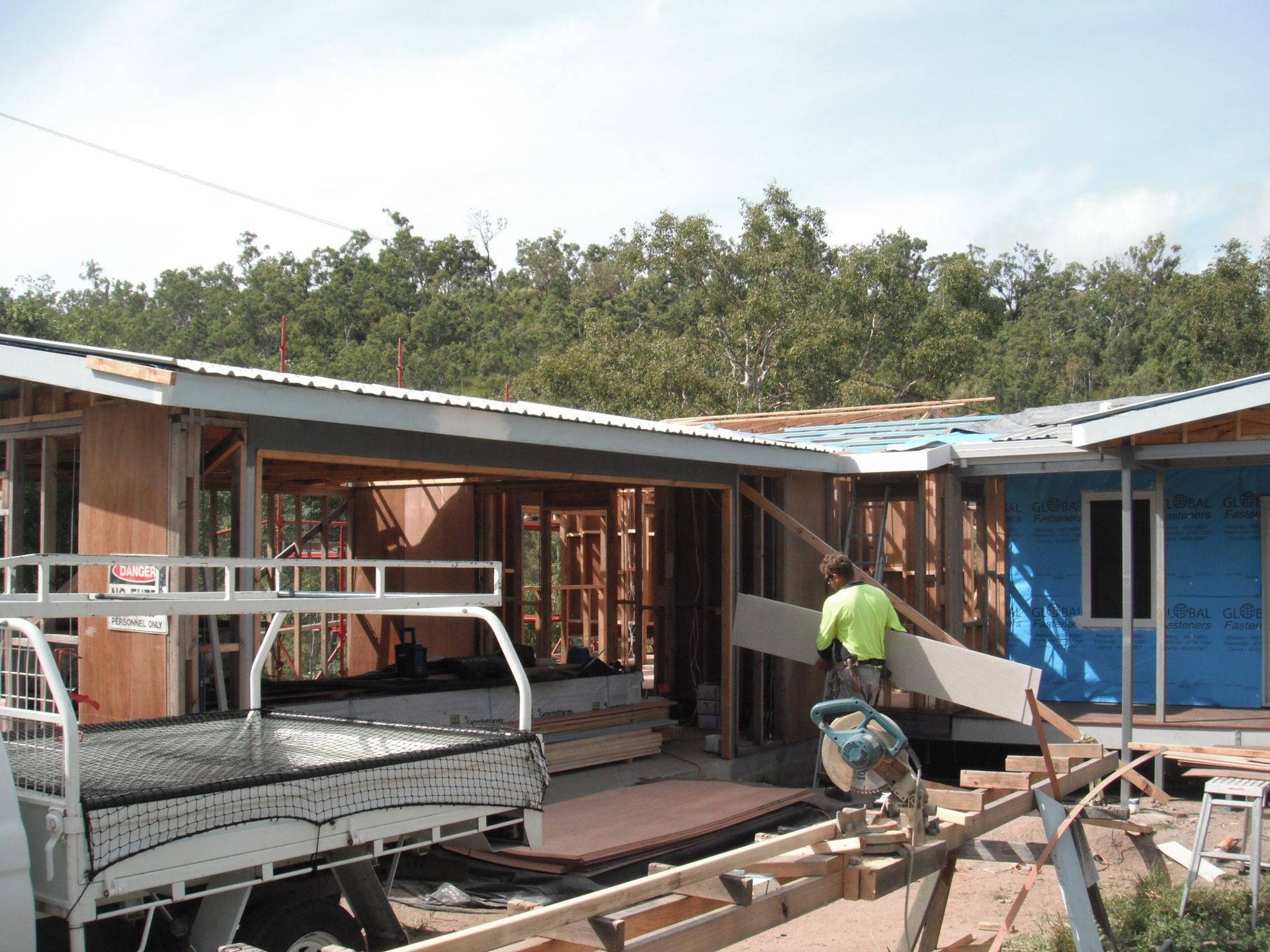A Truck is Parked in Front of a House Under Construction — Shane Firmin Carpentry Pty Ltd In Mount St John, QLD
