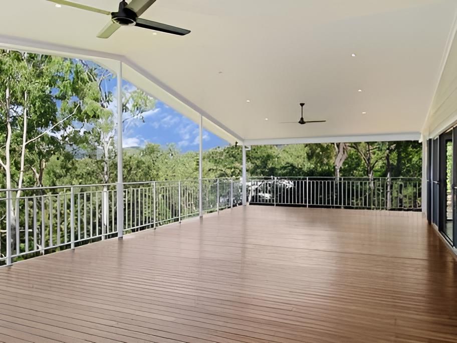 An Empty Deck With a Ceiling Fan and a View of Trees — Shane Firmin Carpentry Pty Ltd In Mount St John, QLD
