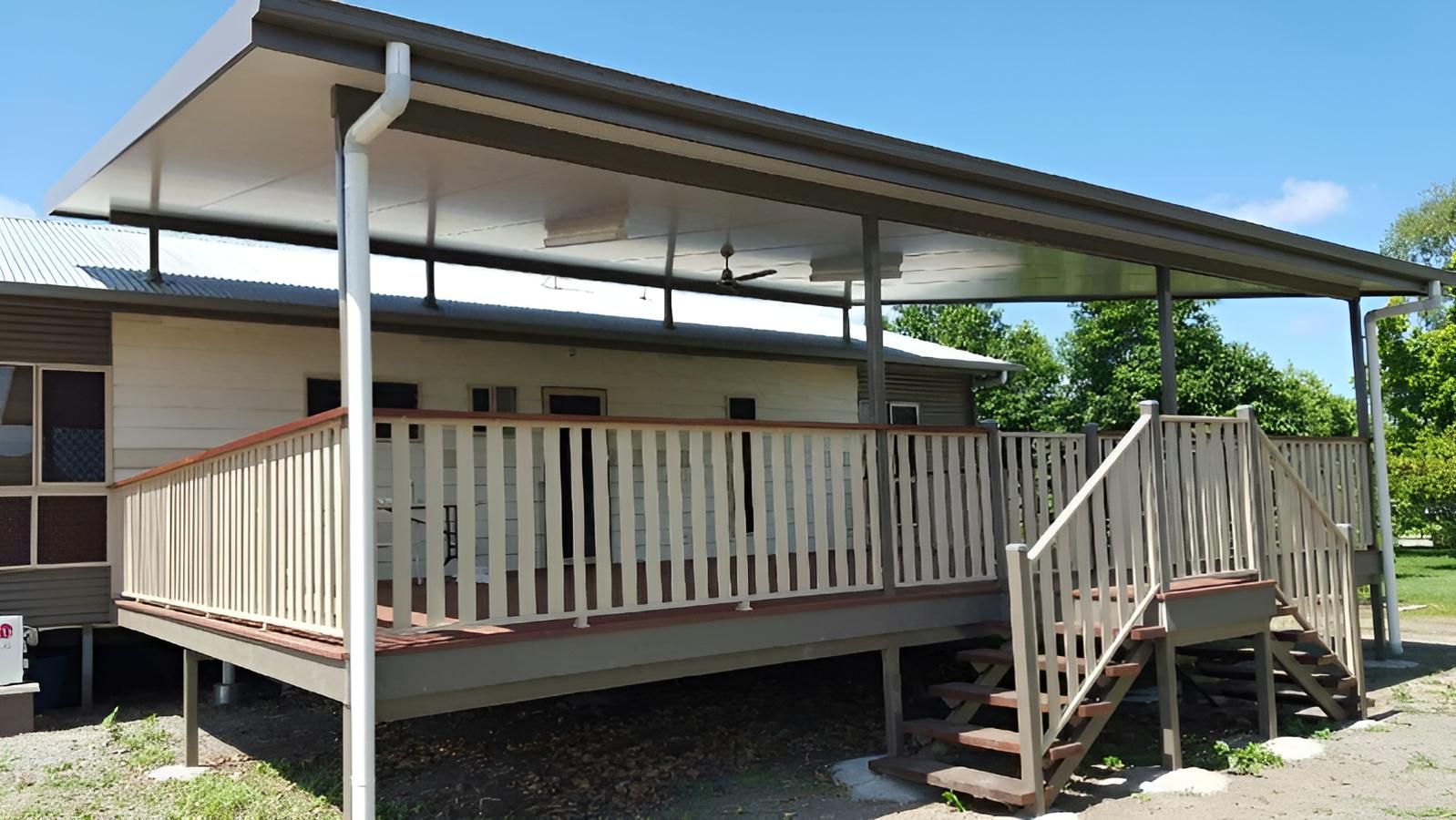 A House With a Large Deck and Stairs — Shane Firmin Carpentry Pty Ltd In Mount St John, QLD