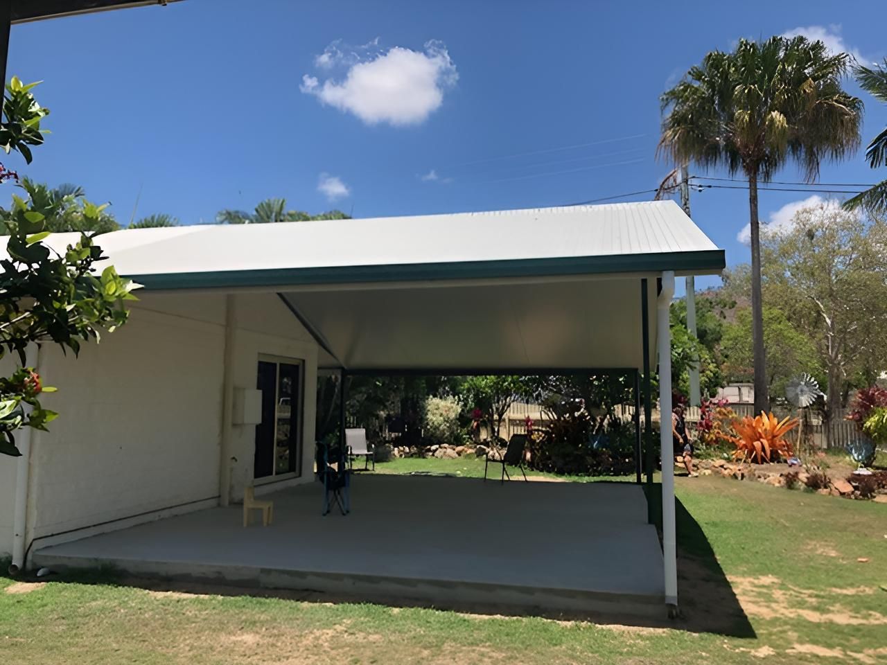 A White House With a Covered Patio in the Backyard — Shane Firmin Carpentry Pty Ltd In Mount St John, QLD