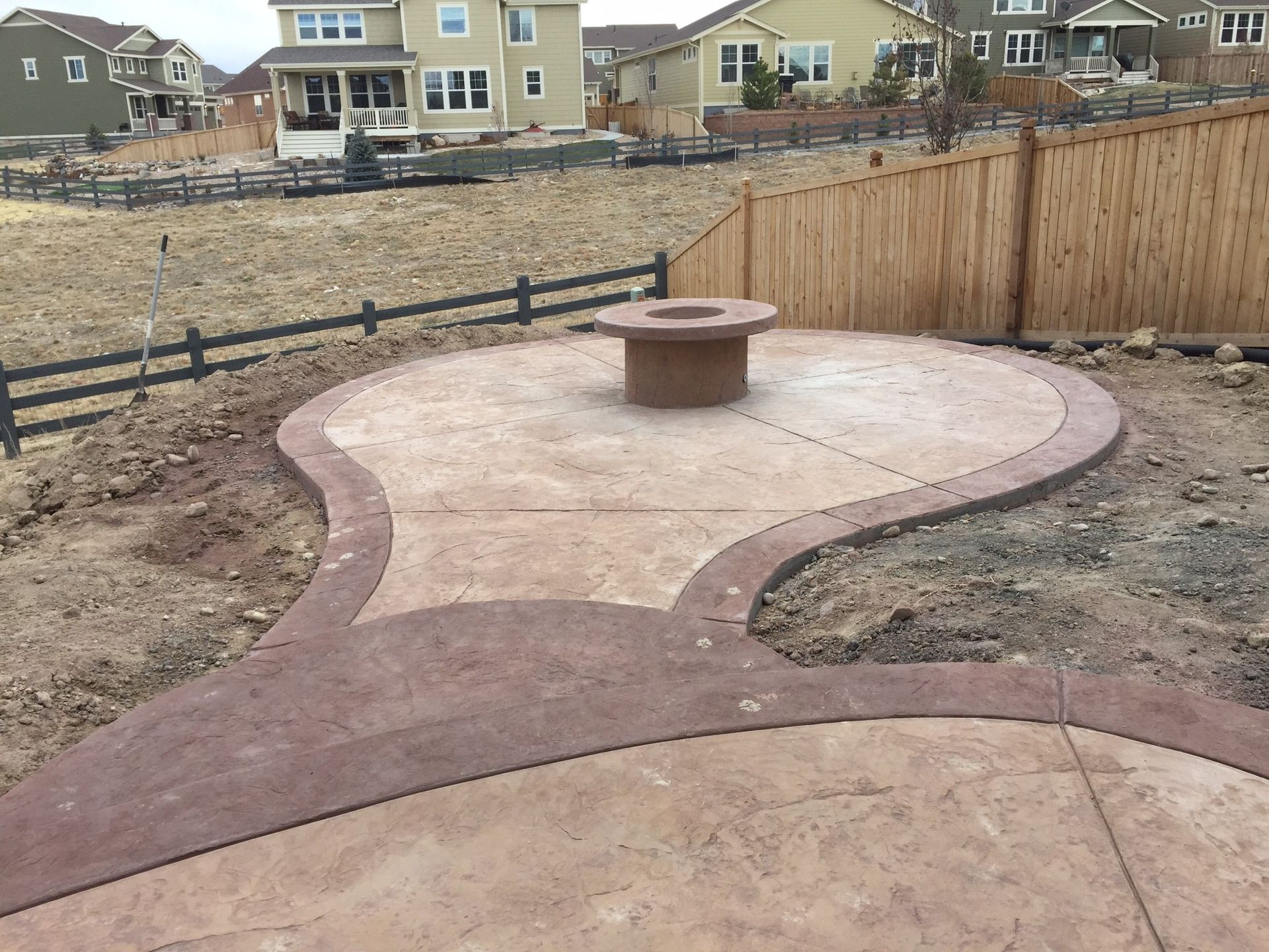 Patio with fire pit, surrounded by Adirondack chairs, brick pavers, and green turf. Patio with fire pit, surrounded by Adirondack chairs, brick pavers, and green turf.