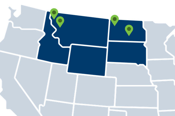 Map of the Northwestern U.S. with four green location markers on a blue background.