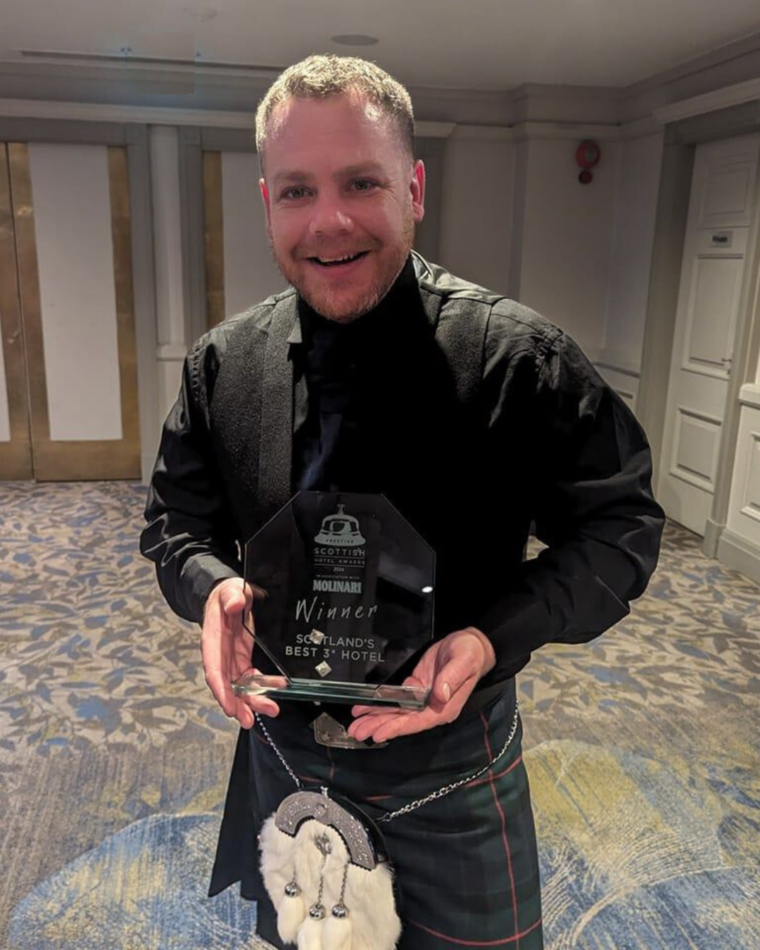 Photo of Chef Kevin Gunn holding an award