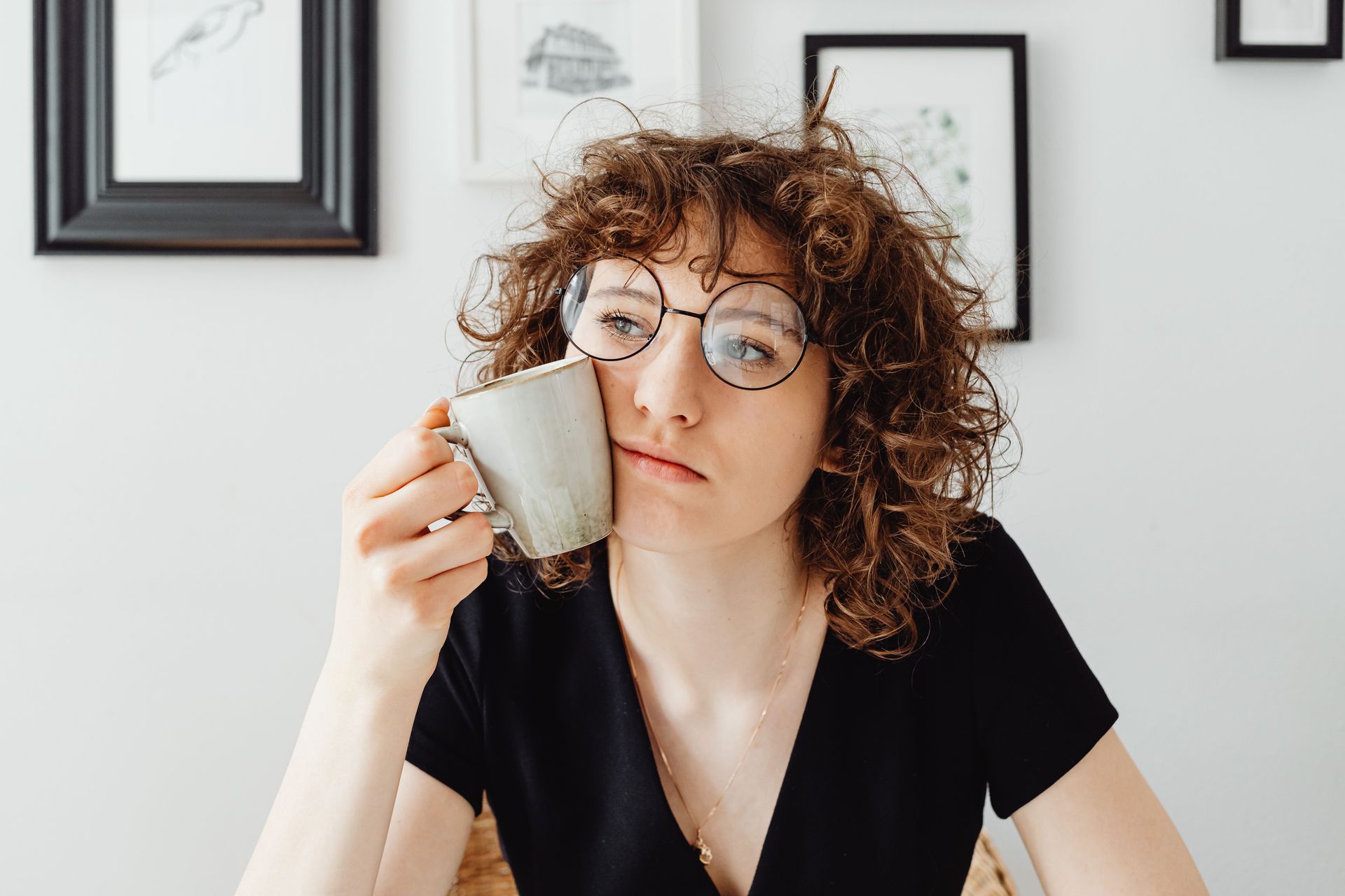 Woman in her 40s looking thoughtful represents late-diagnosed ADHD symptoms during perimenopause