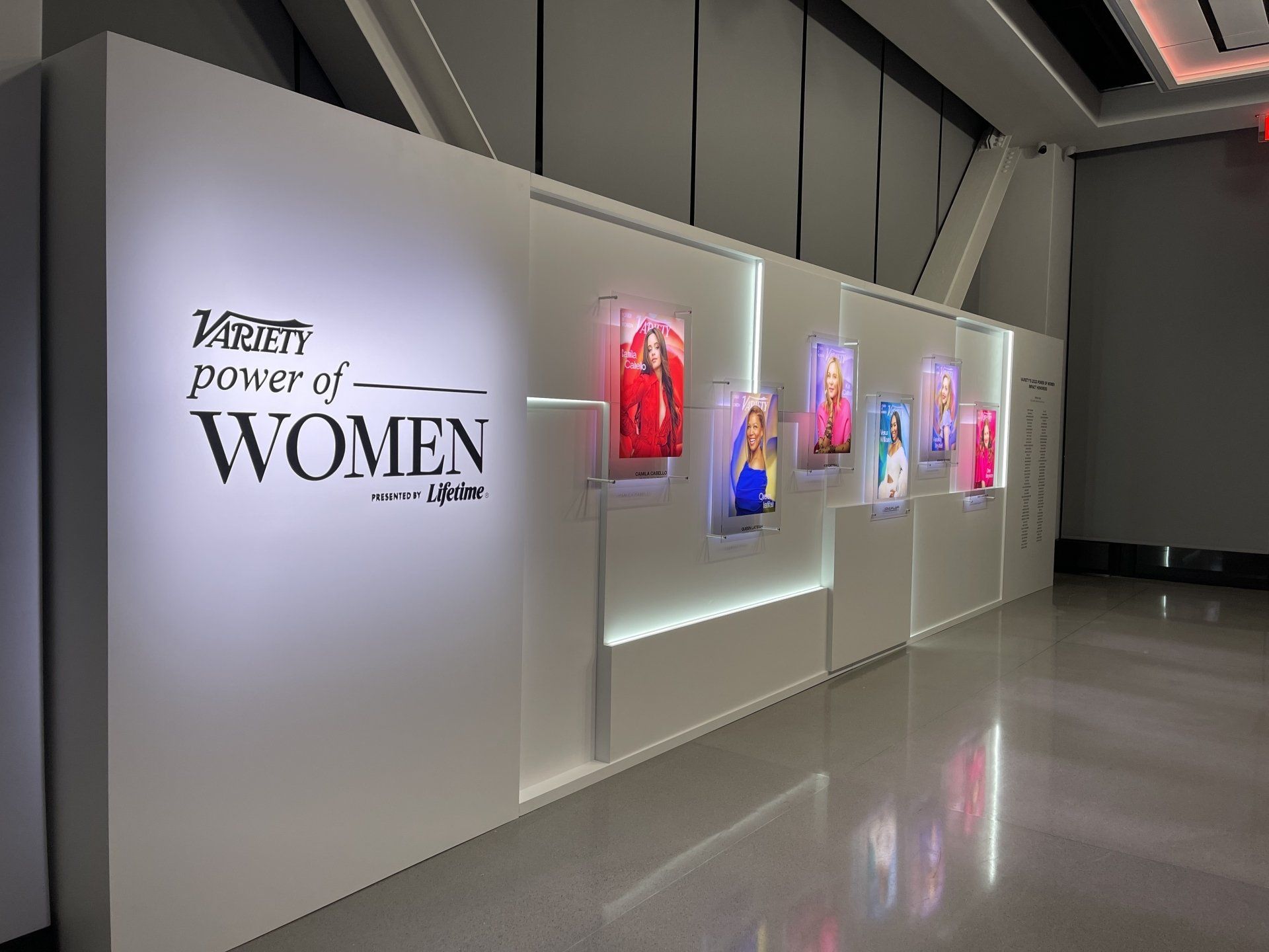 A wall with a sign that says variety power of women