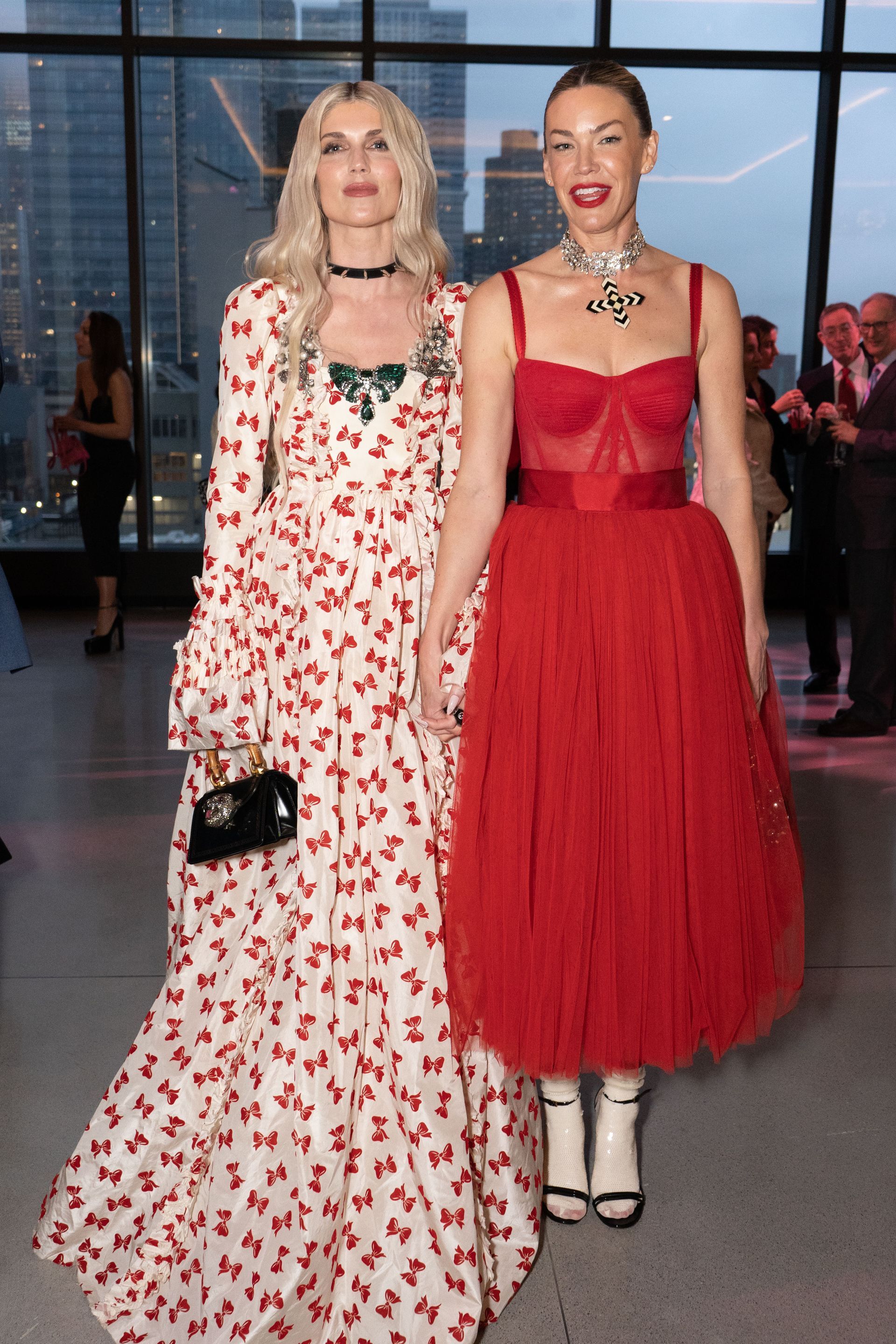 Planned Parenthood Event at The Glasshouse - photo of two women are standing next to each other in red and white dresses .