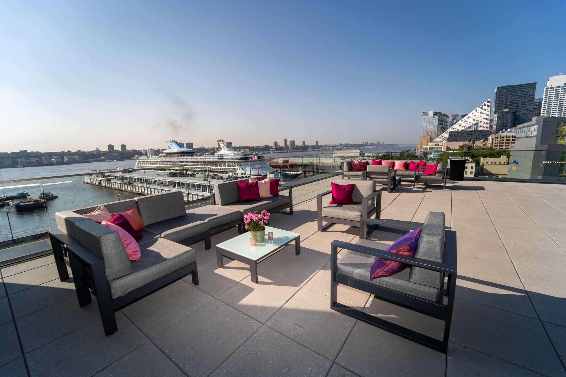 High line gala at The Glasshouse - there are a lot of chairs and a table on the roof .