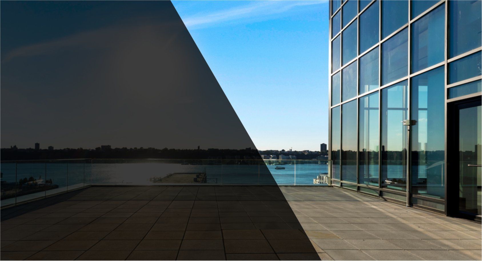 A building with a lot of windows and a balcony overlooking a body of water.