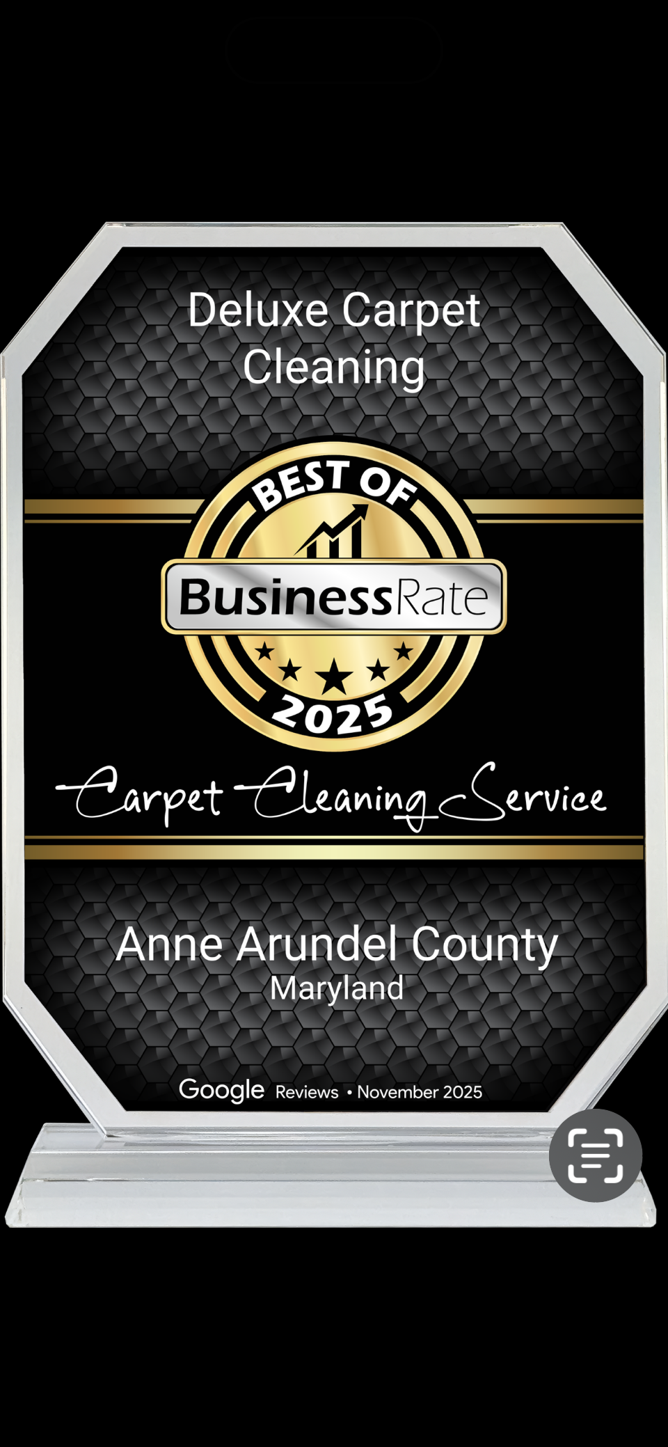 Trophies plaque for Best of Business Award, honoring Deluxe Carpet Cleaning with white text on black background