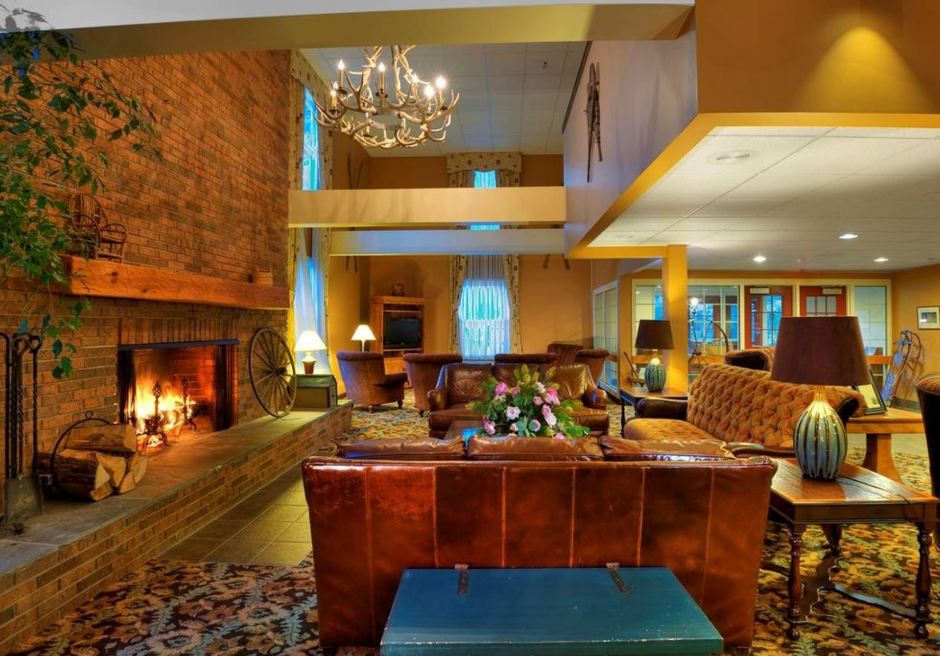 A living room with a fireplace and lots of furniture