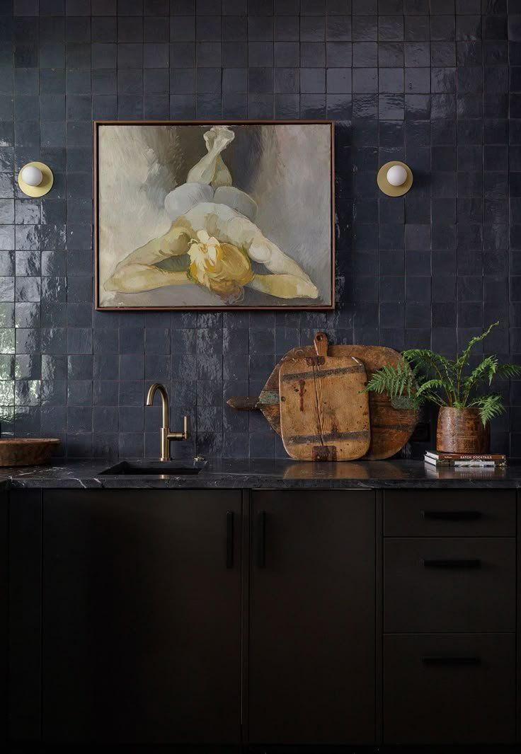 Dark Kitchen Counter With Sink, Wooden Tray And Potted Plants — Everyday Interiors in Helensburgh, NSW
